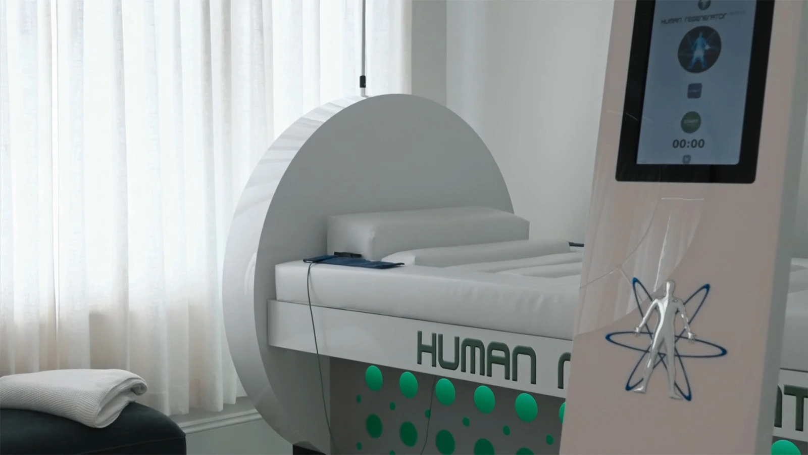 A serene, high-tech wellness clinic environment with a person receiving treatment